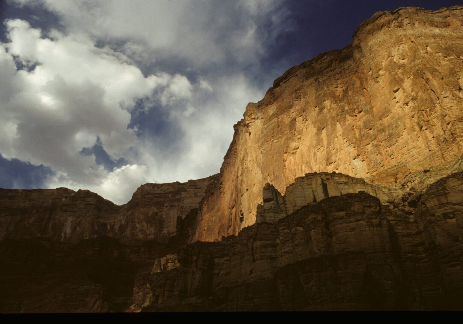 A rock wall with a sky background